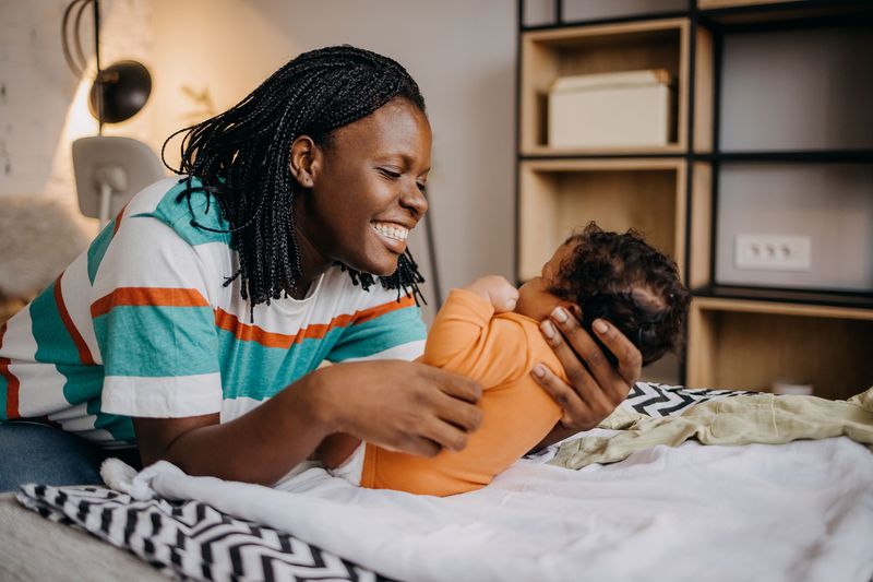 A mother with her newborn considers life insurance.