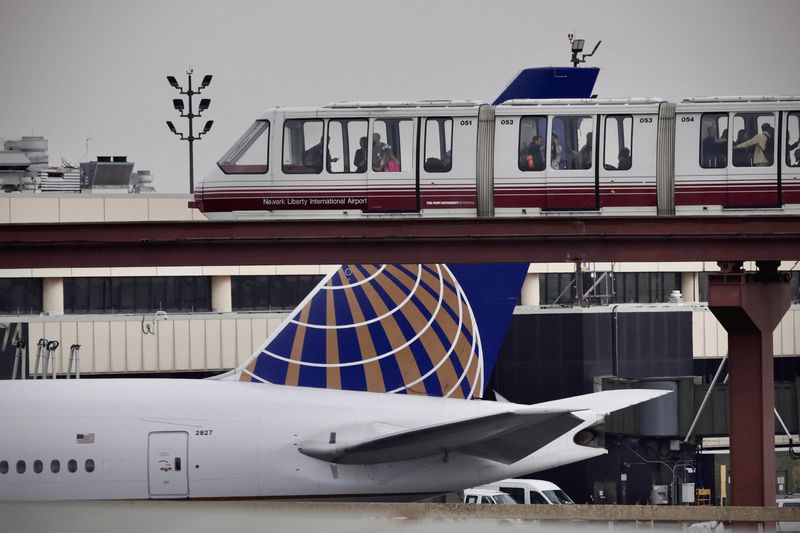 Passengers ride the air train at Newark Liberty International Airport in Newark, New Jersey on May 7, 2025