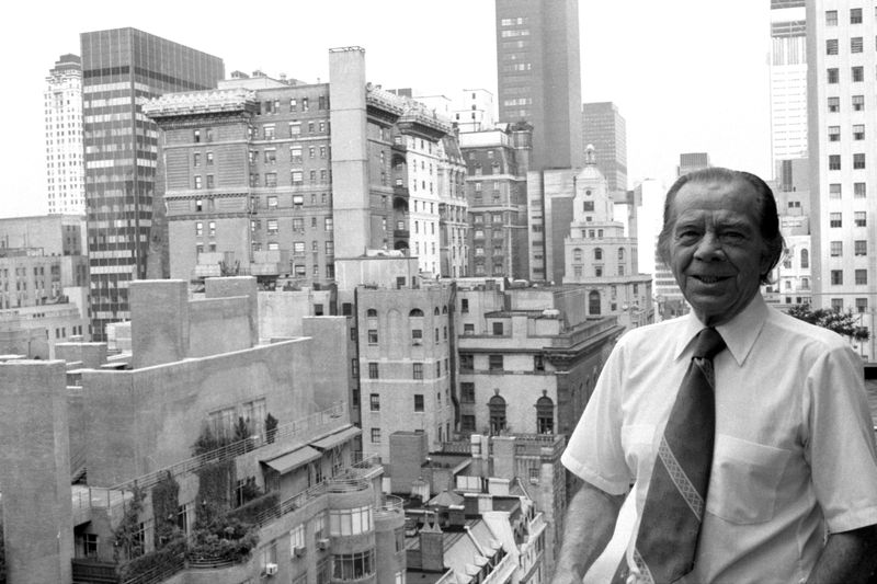 A photo of Willie Sutton standing on a rooftop with the skyline in the background in Manhattan New York.