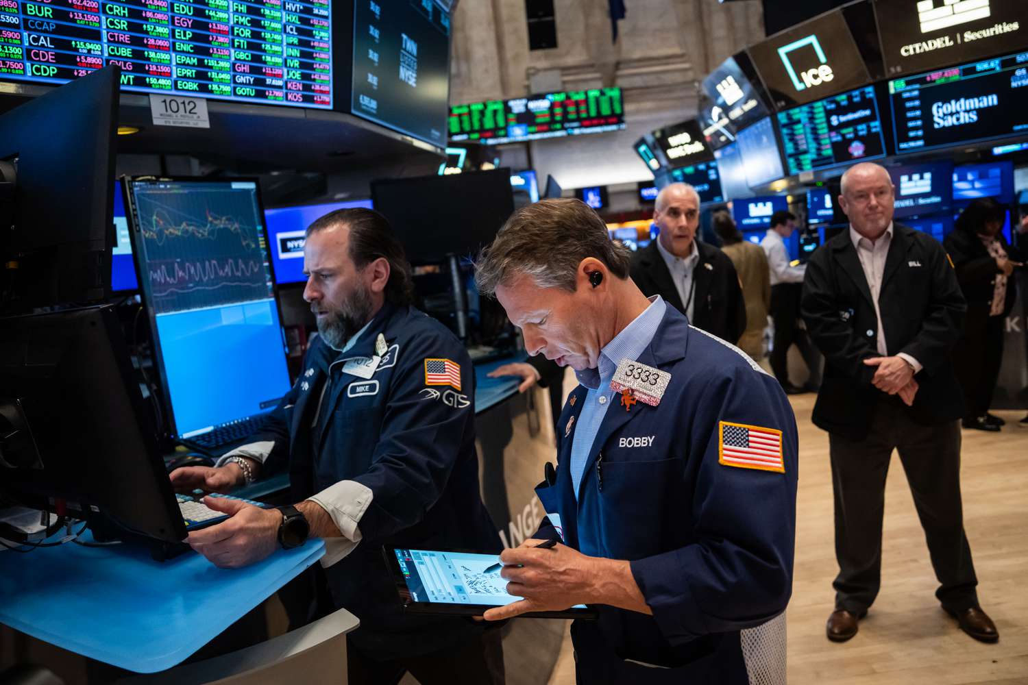 Traders work on the floor of the New York Stock Exchange