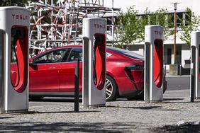 A Tesla car charges at a Tesla charging station on the grounds of the Euref-Campus Berlin