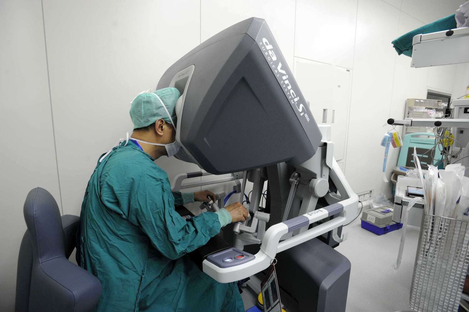 Surgeon operating a da Vinci surgical robot made by Intuitive Surgical Inc.