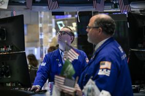 Traders work on the floor of the New York Stock Exchange