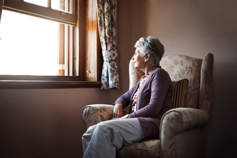 Shot of a senior woman sitting alone in her living room