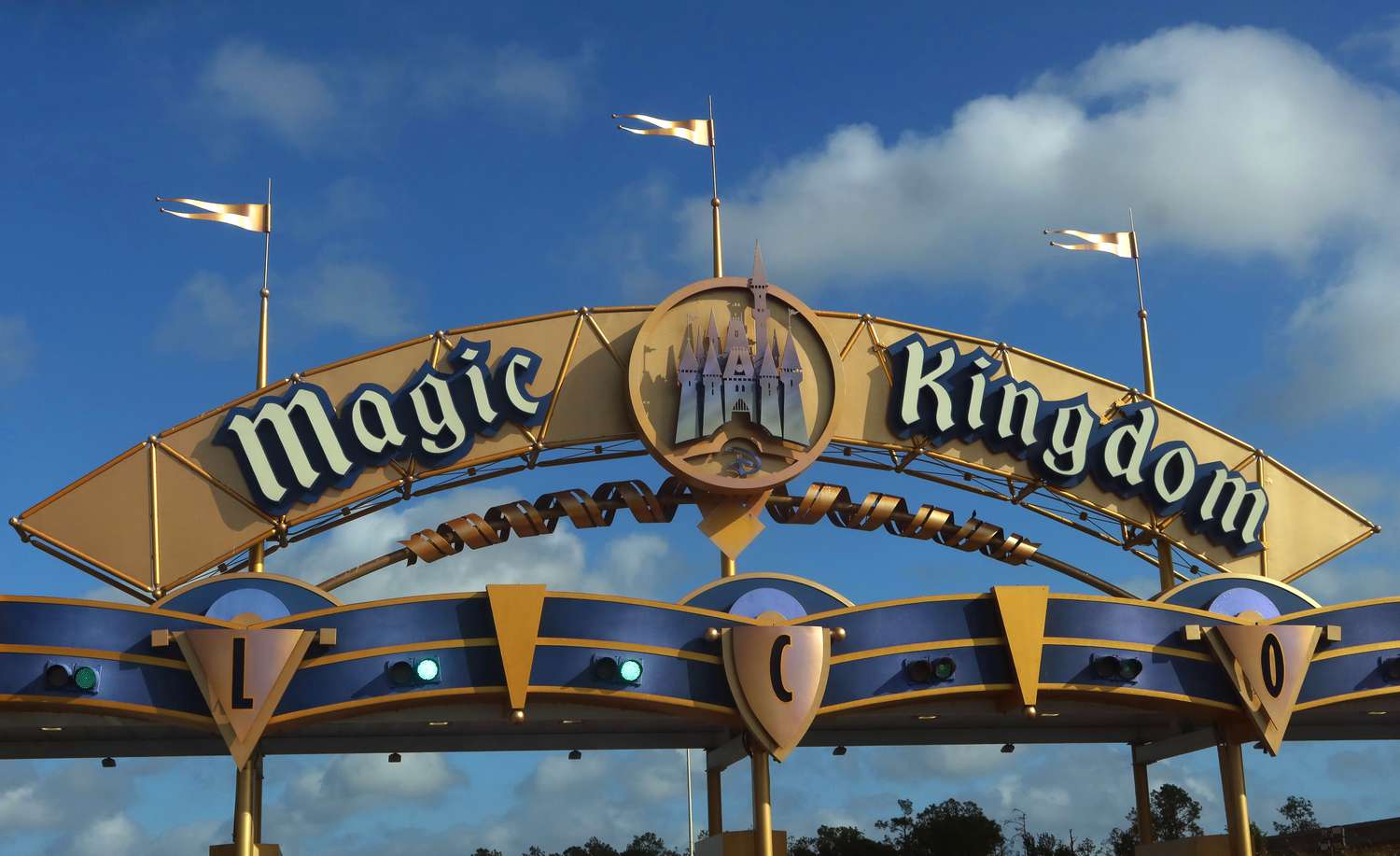 A sign for the Magic Kingdom hangs above the entrance to the grounds of the park at Walt Disney World on April 3, 2025, in Orlando, Florida