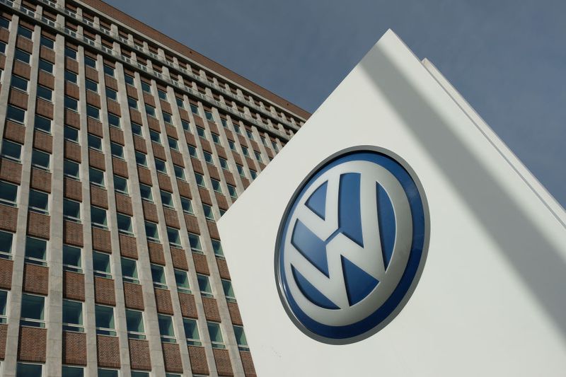 The company logo of automaker Volkswagen AG stands outside Volkswagen headquarters.