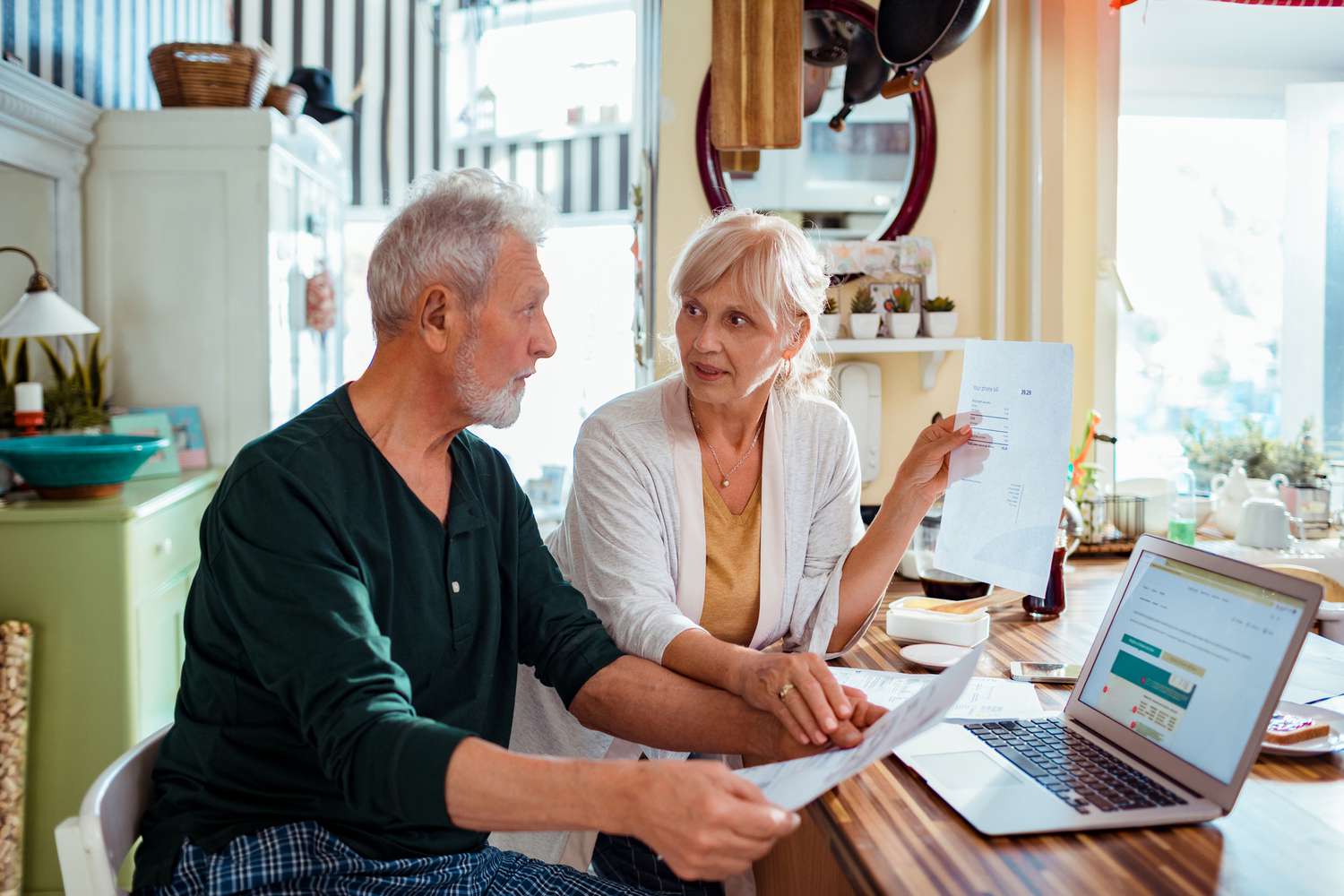 Older couple doing financial planning at home