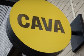 A sign marks the location of a CAVA restaurant on May 28, 2024 in Chicago, Illinois