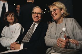 Warren Buffett, CEO of Berkshire Hathaway, attends the company's annual shareholders' meeting with his daughter (left) and his wife, both named Susan.