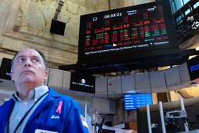 Traders work on the floor of the New York Stock Exchange.