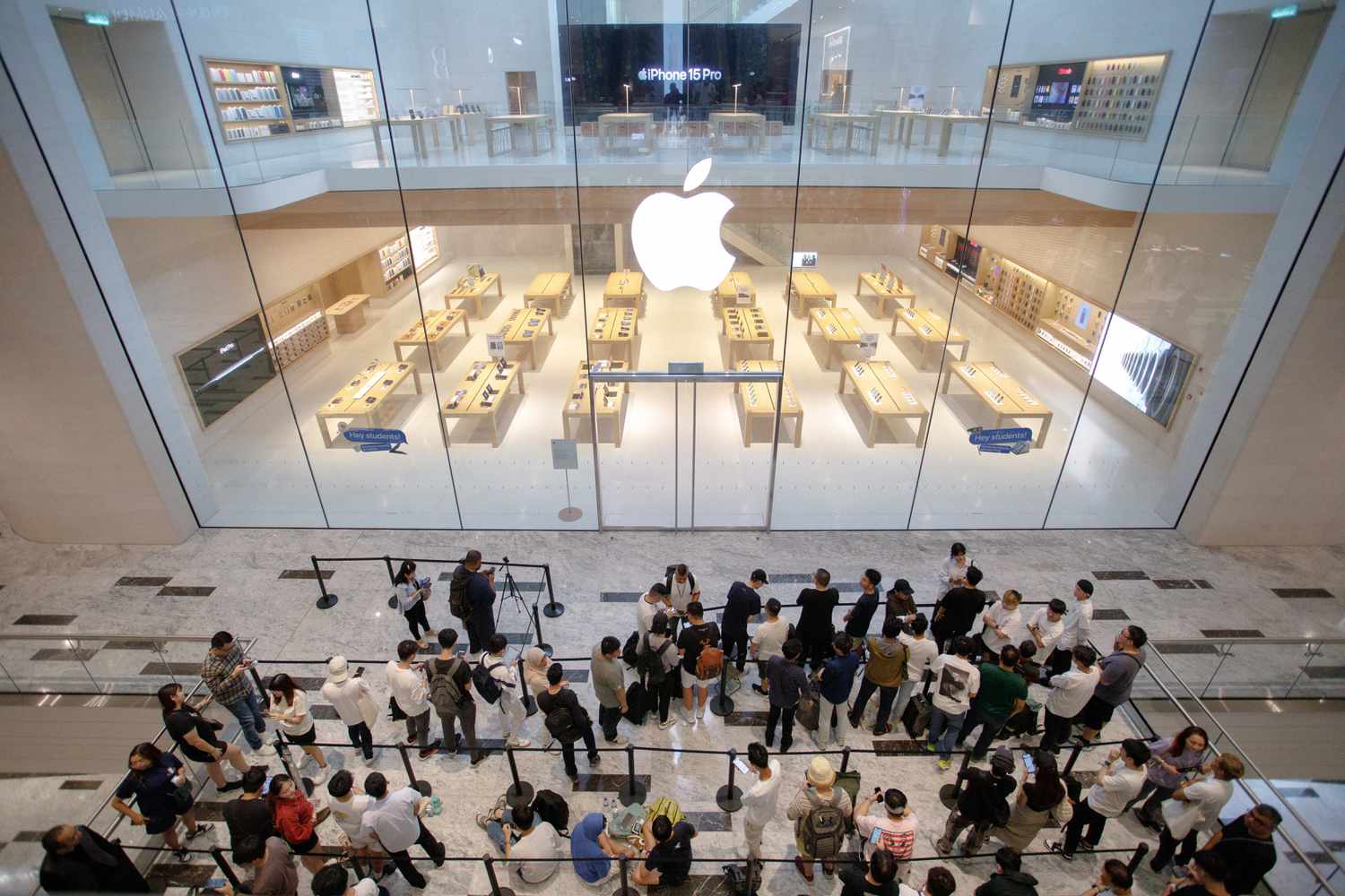 Customers wait in line outside the Apple Inc. store ahead of its opening in Kuala Lumpur, Malaysia, on Saturday, June 22, 2024. 