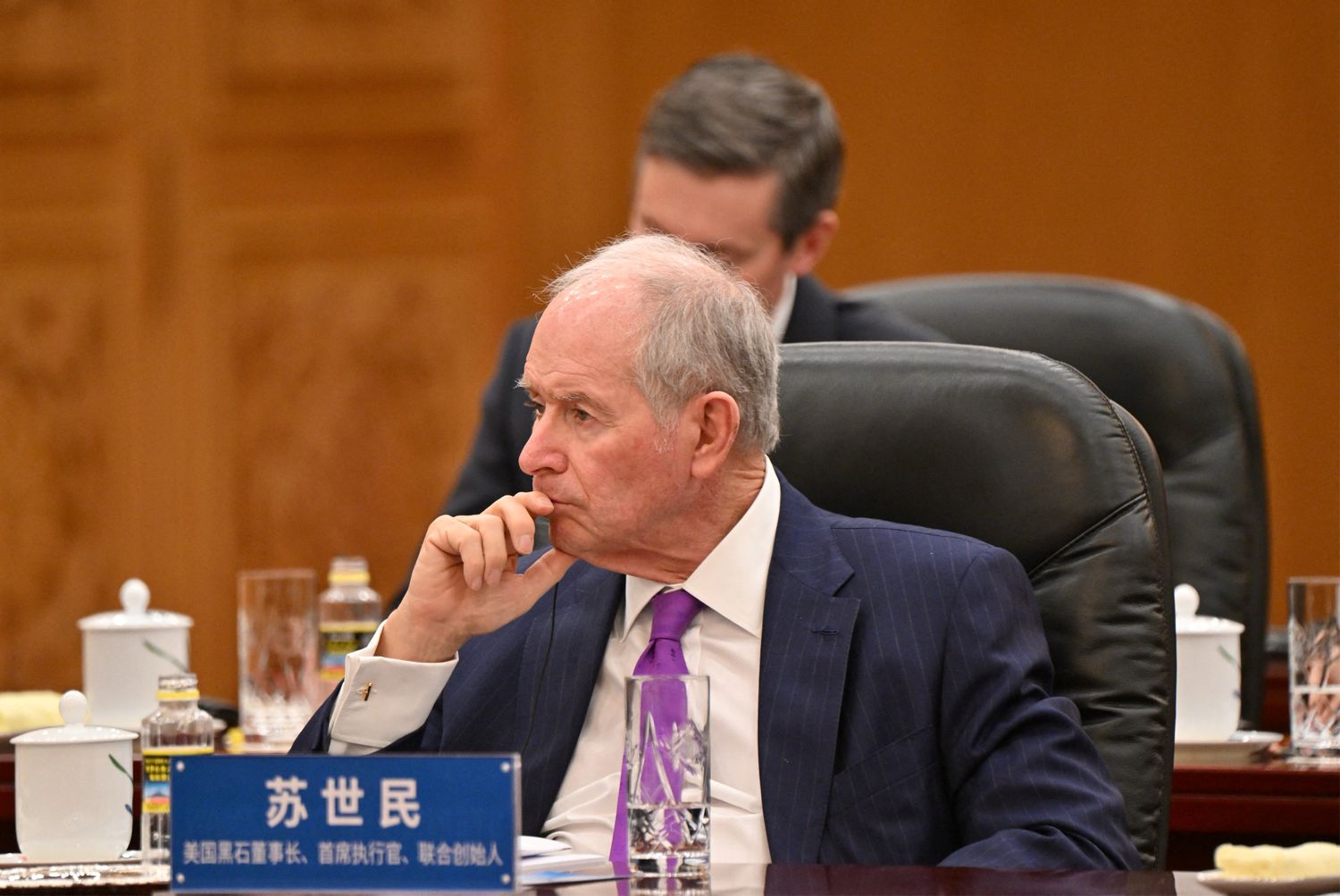 Stephen Schwarzman (C), CEO of Blackstone Inc., attends a meeting between China's President Xi Jinping and a group of foreign executives at the Great Hall of the People in Beijing on March 28, 2025. 