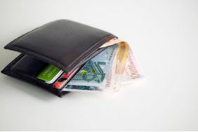 A wallet full of cards and bills