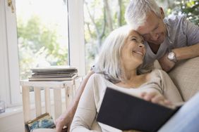 Older couple with their heads together, smiling