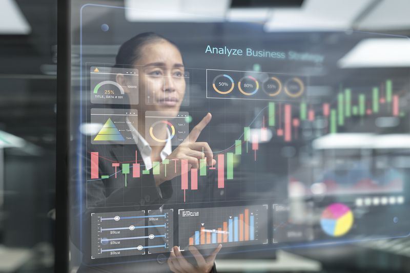 Business person pointing to finance business chart and data