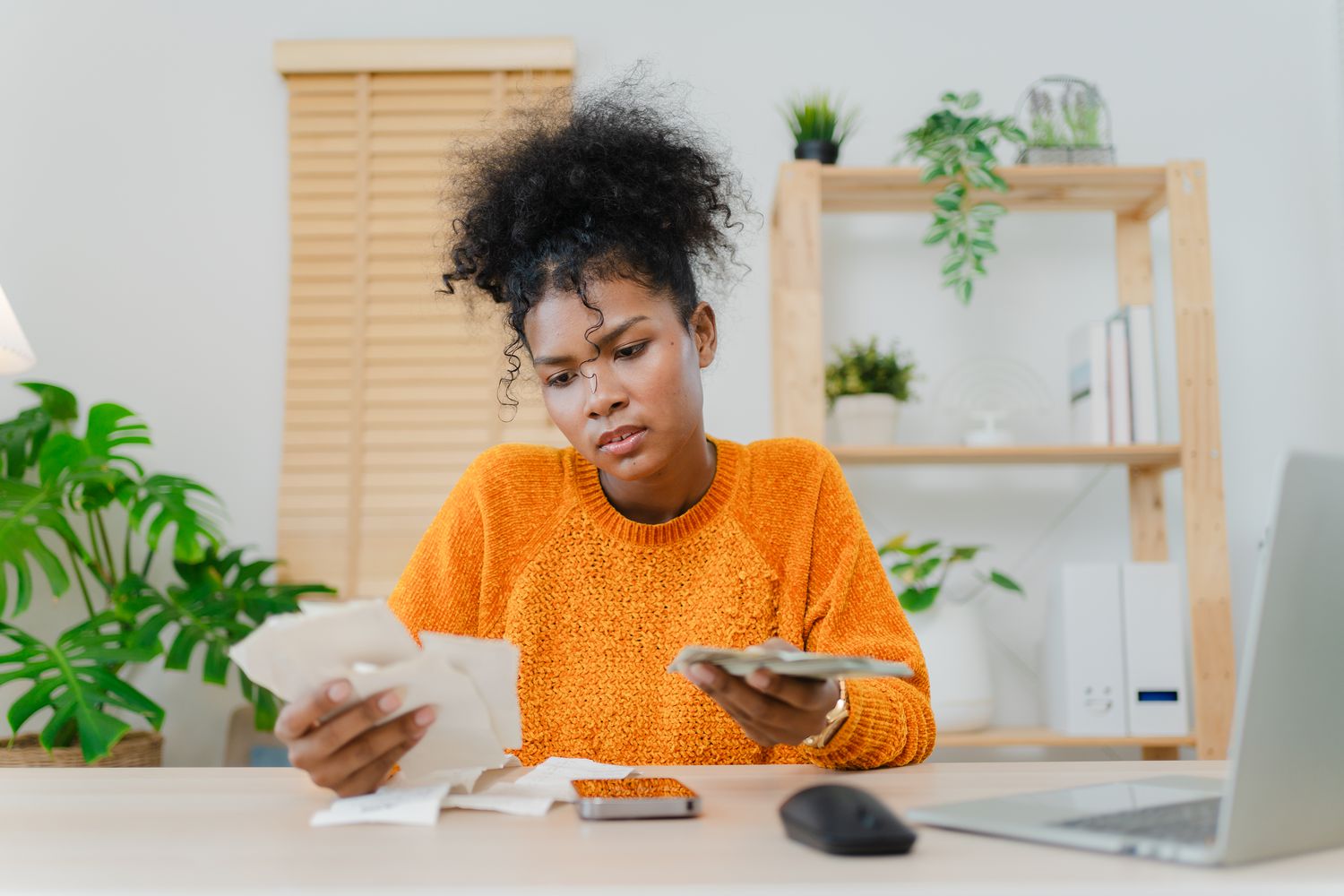 Woman calculating student loan limits