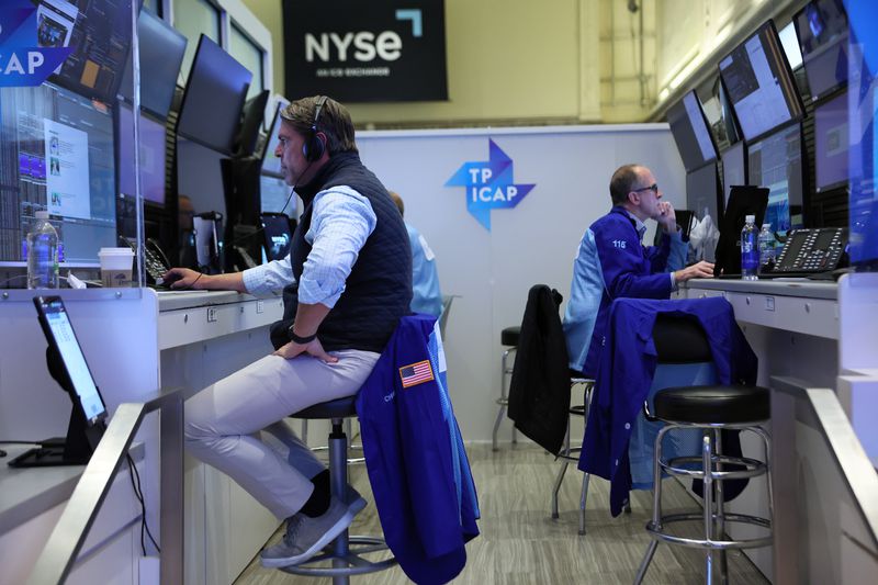 Traders work on the floor of the New York Stock Exchange
