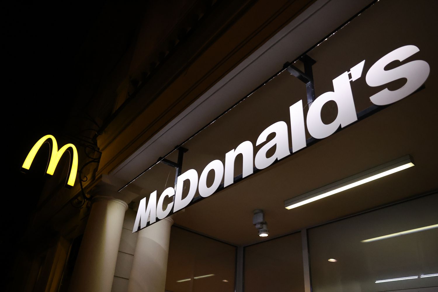 The McDonald's golden arches logo and sign are seen outside a restaurant.