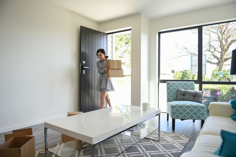 Indoor life portrait of a young woman in new apartment