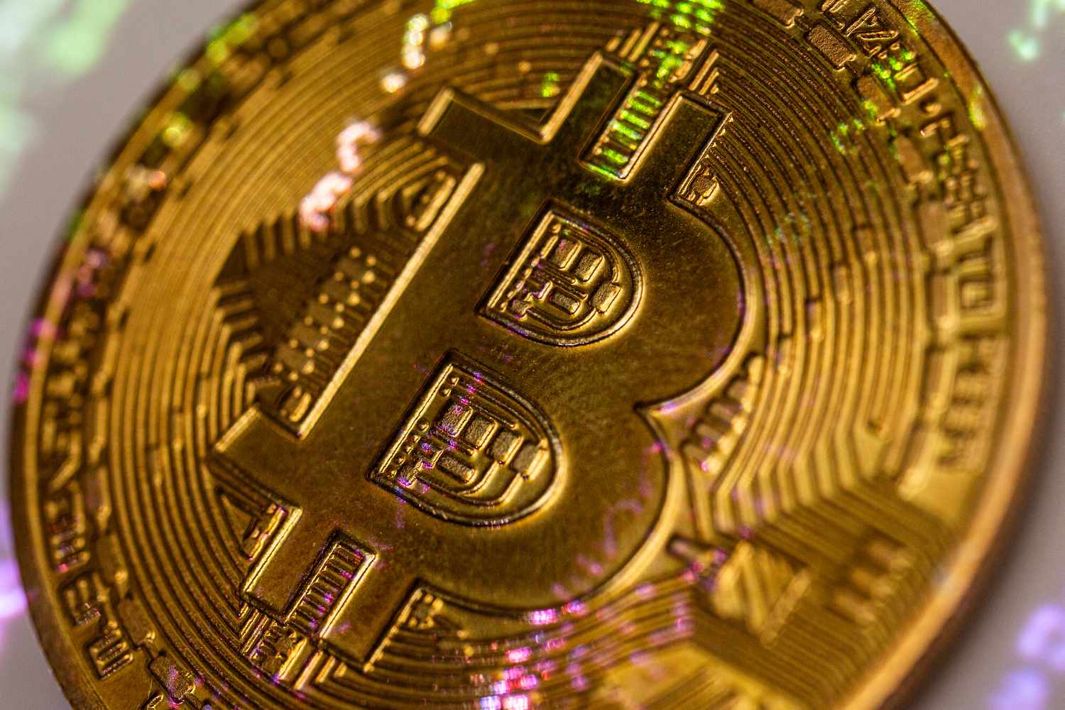 A yellow coin with the B symbol for Bitcoin.