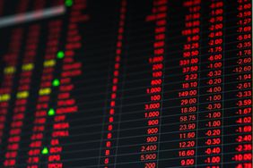 Stock market board showing all red, indicating a market crash where stock prices are dropping abruptly. 