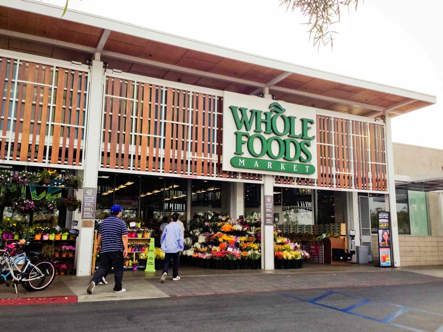 Whole Foods Market, Venice, California; a few people entering the store.
