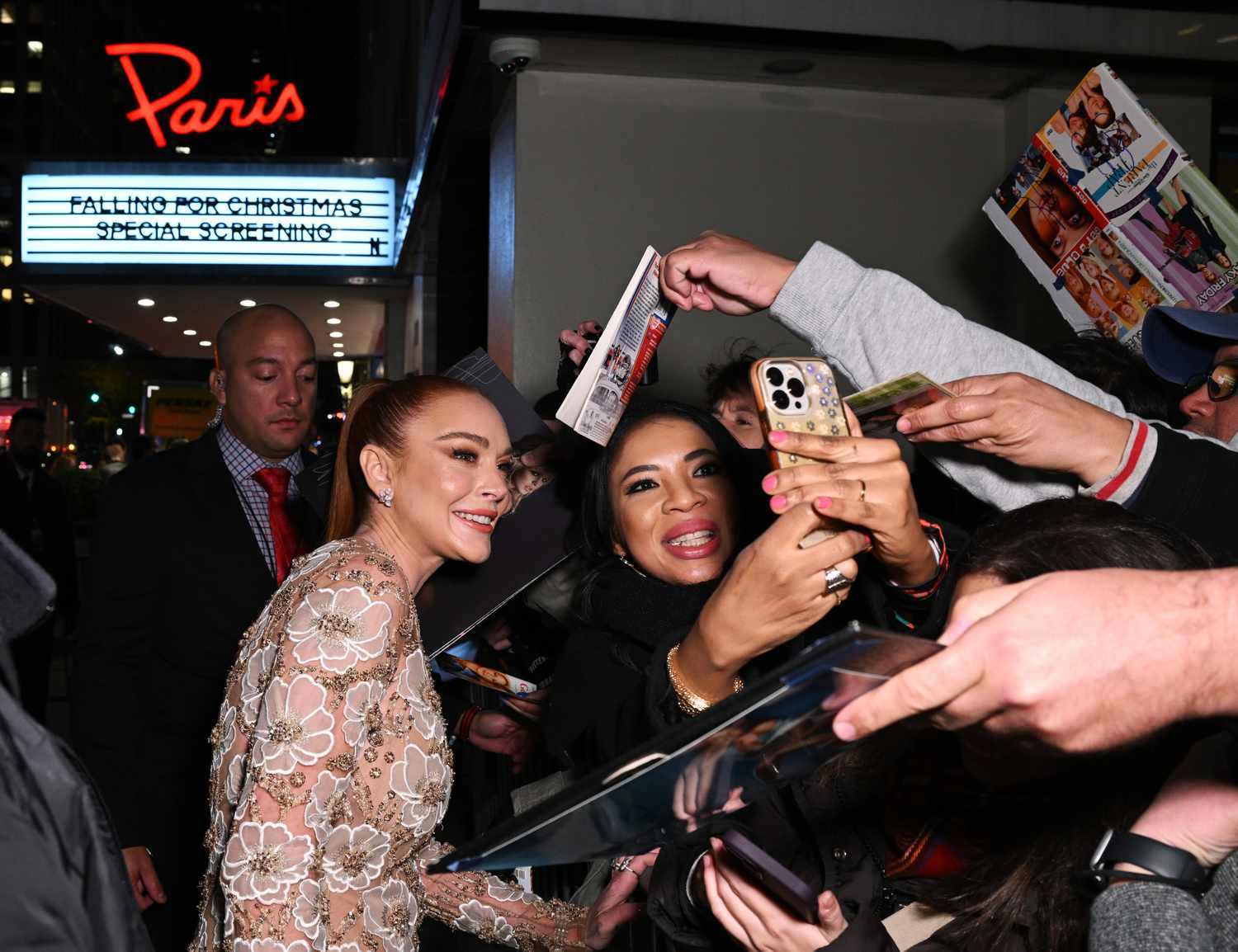 Lindsay Lohan poses with fans at Netflixâs Falling For Christmas Celebratory Holiday Fan Screening with Cast & Crew on November 9, 2022 in New York City.