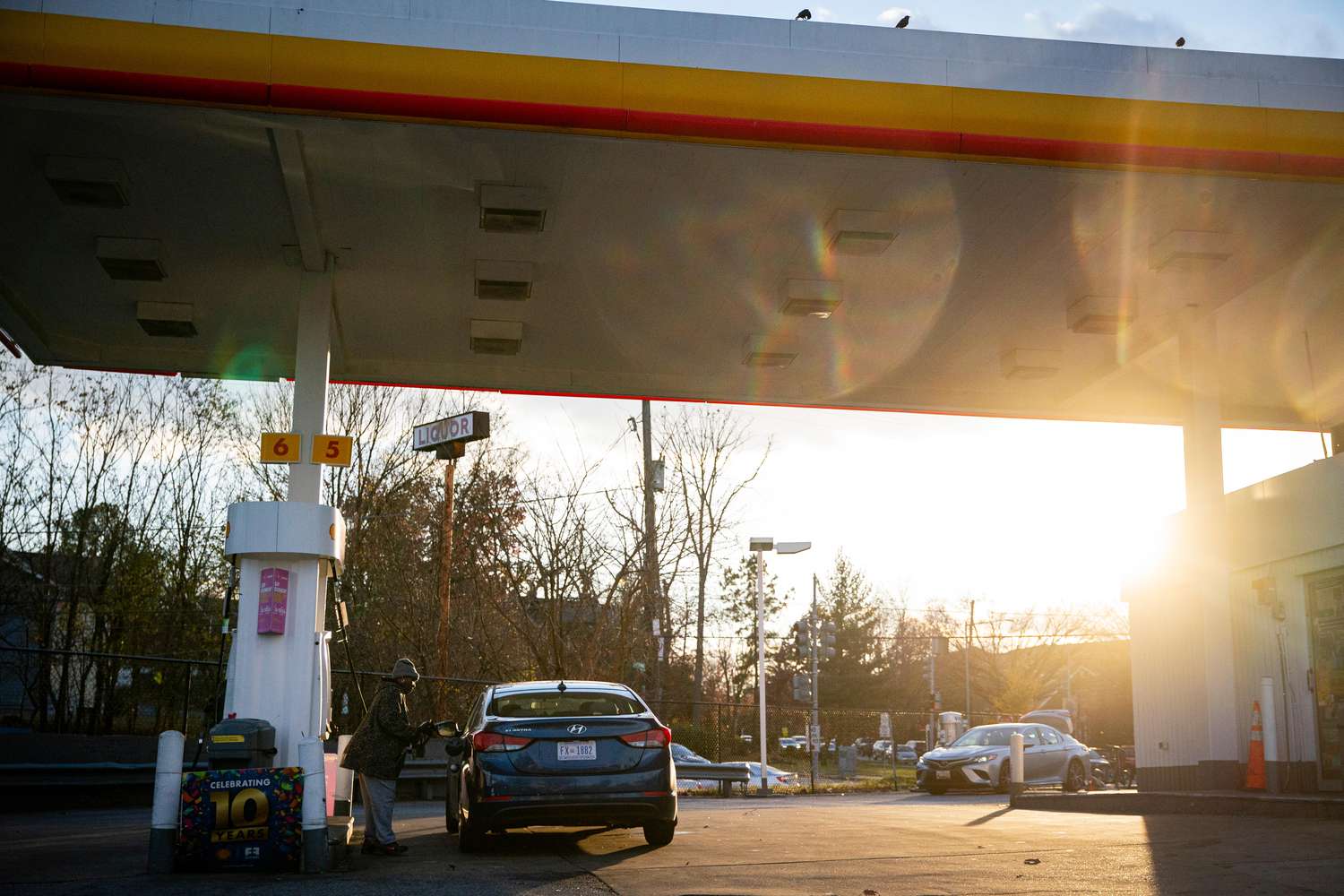 A driver pumps gas at a Shell gas station in Washington, DC, US, on Tuesday, Nov. 28, 203.