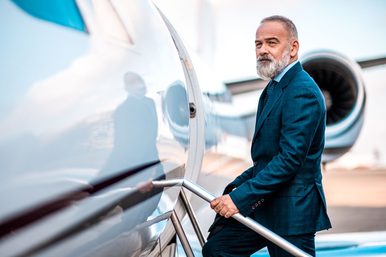 A venture capitalist boards a private jet.