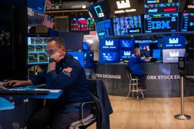 Traders work on the floor of the New York Stock Exchange