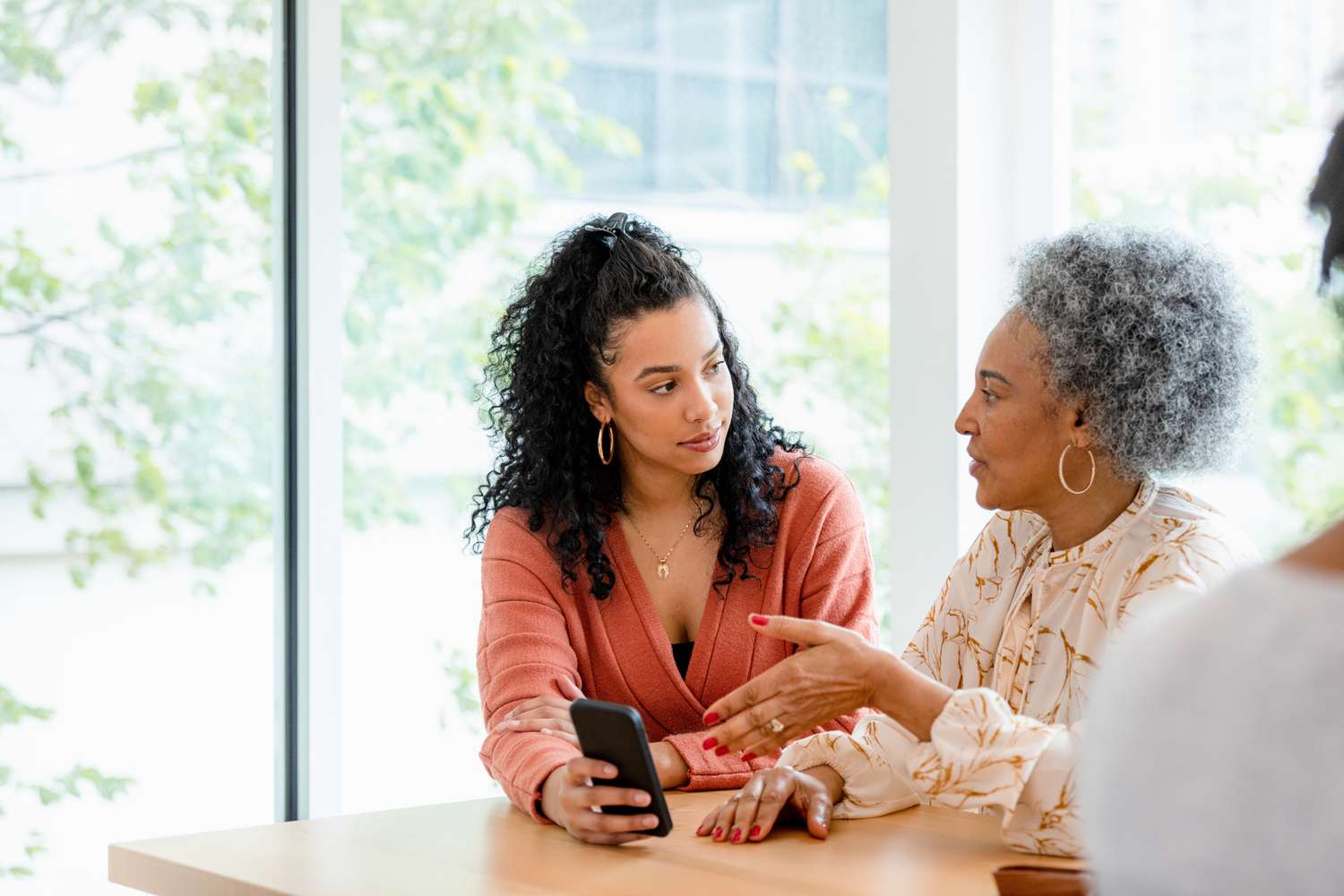 Woman asking a consultant about a prepaid tuition plan