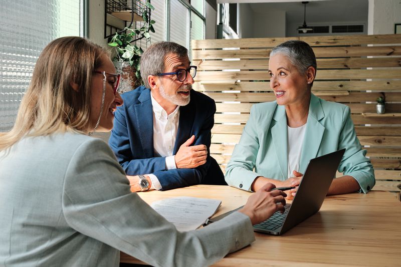 A financial advisor meeting with clients