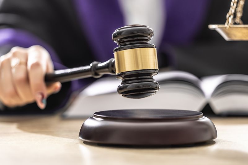 A judge bangs a gavel to end a hearing that determined punitive damages in a misrepresentation case.