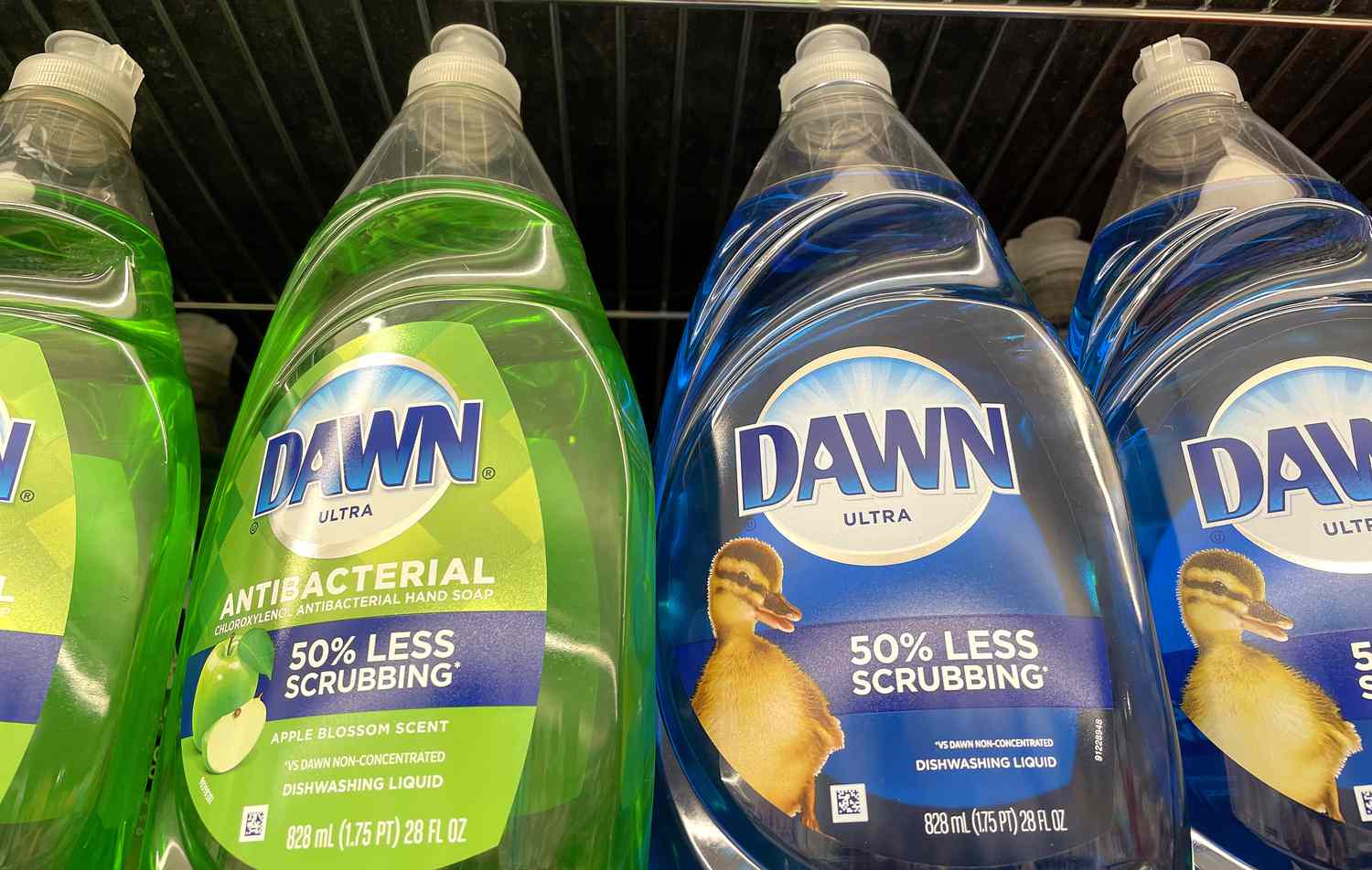 Bottles of Dawn liquid dish soap sit on a store shelf.