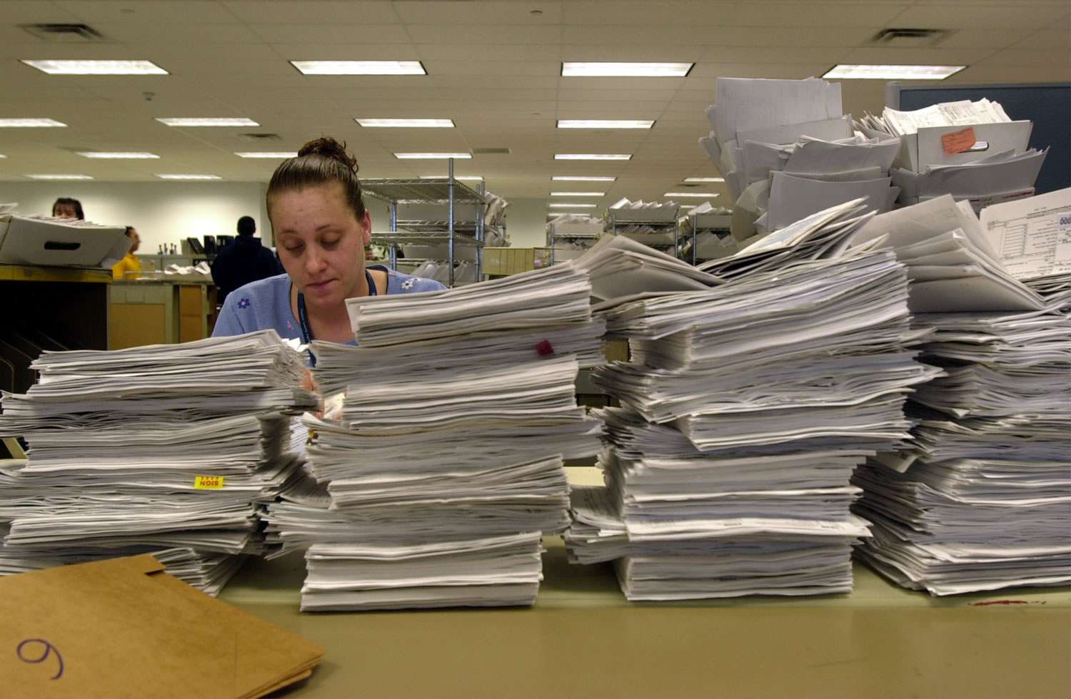 IRS Office with Paperwork Mountain