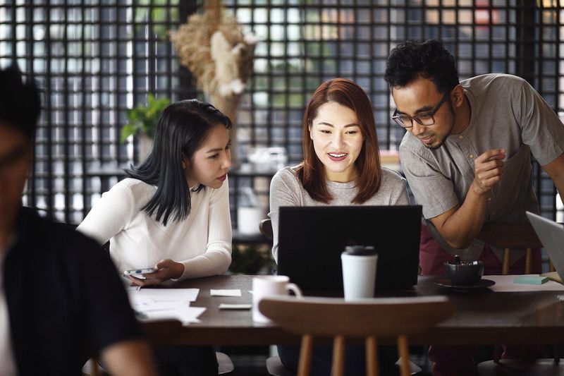 Group of people working in a co-working office.