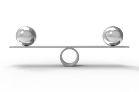 Two orbs on a balanced scale