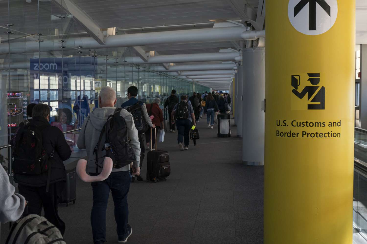 U.S. Customs and Border Protection CBP sign, inscription and symbol in yellow background in Newark Liberty International Airport