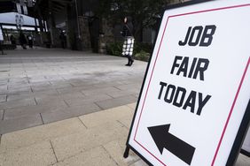 Sign reading "Job Fair Today" outside a building