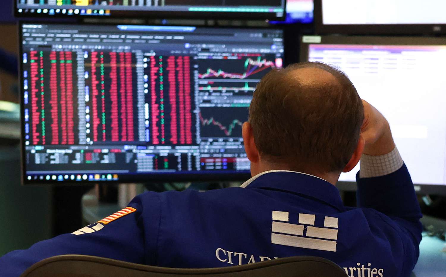 A trader works on the floor of the New York Stock Exchange 