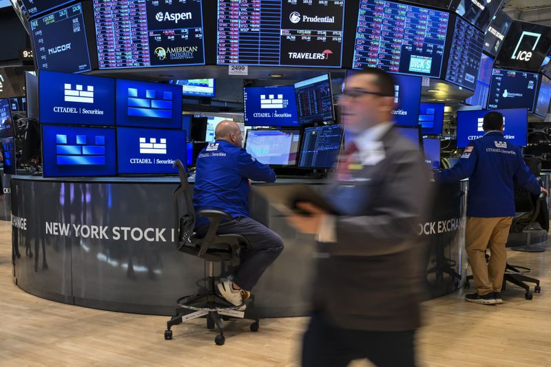 Traders work on the floor of the New York Stock Exchange