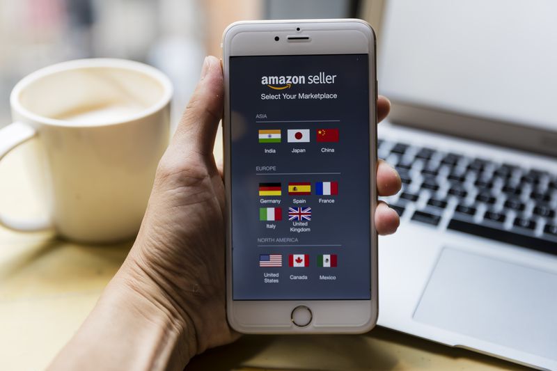 A smartphone with the Amazon Seller app displayed on the screen
