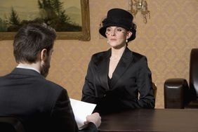 Woman in Mourning Meeting with Lawyer