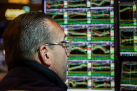 A trader works on the floor at the New York Stock Exchange.