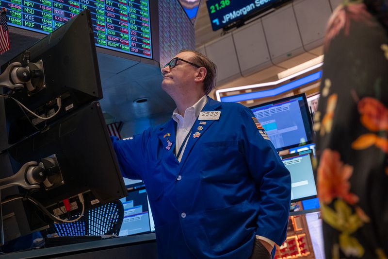 Traders work on the floor of the New York Stock Exchange