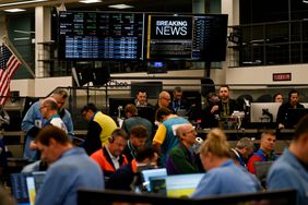 Stock information displayed as traders work in the S&P options pit at the Cboe Global Markets exchange in Chicago, Illinois, on Nov. 7, 2024