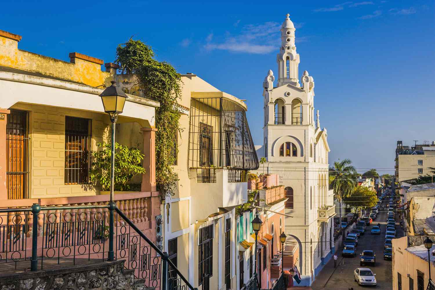 View of Calle (street) Hostos an old and historical street that runs from North to South through the heart of the Ciudad Colonial, Colonial district of Santo Domingo, on the left the Iglesia (church) Nuestra SeÃ±ora de la Altagracia.