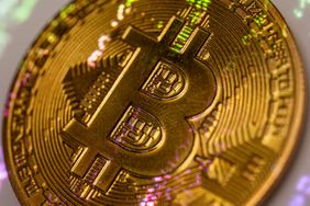 A yellow coin with the B symbol for Bitcoin.