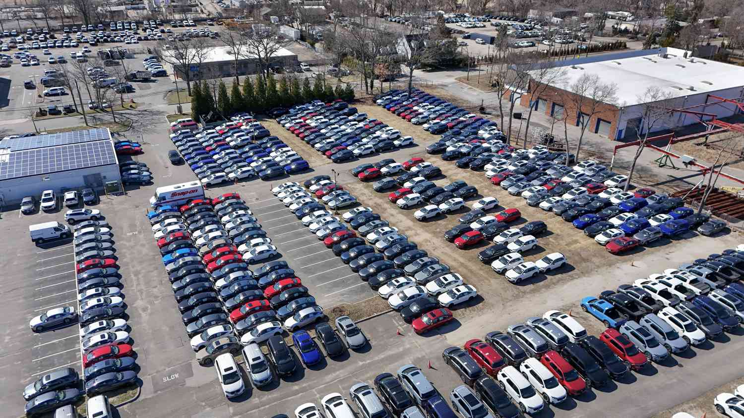 Cars at a dealership in Smithtown, N.Y., in late March. 