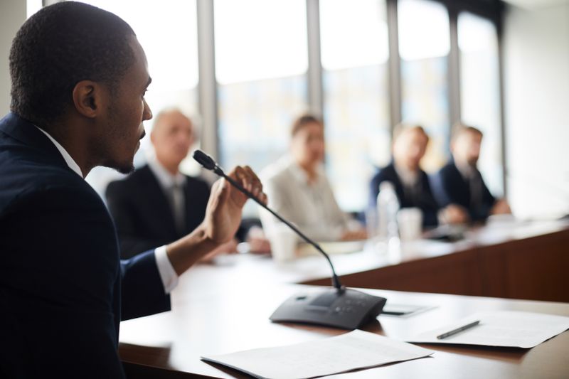 Investor ask questions during a County Commissioners meeting about the municipal bond being issued as a form of sub-sovereign obligation to fund local projects.